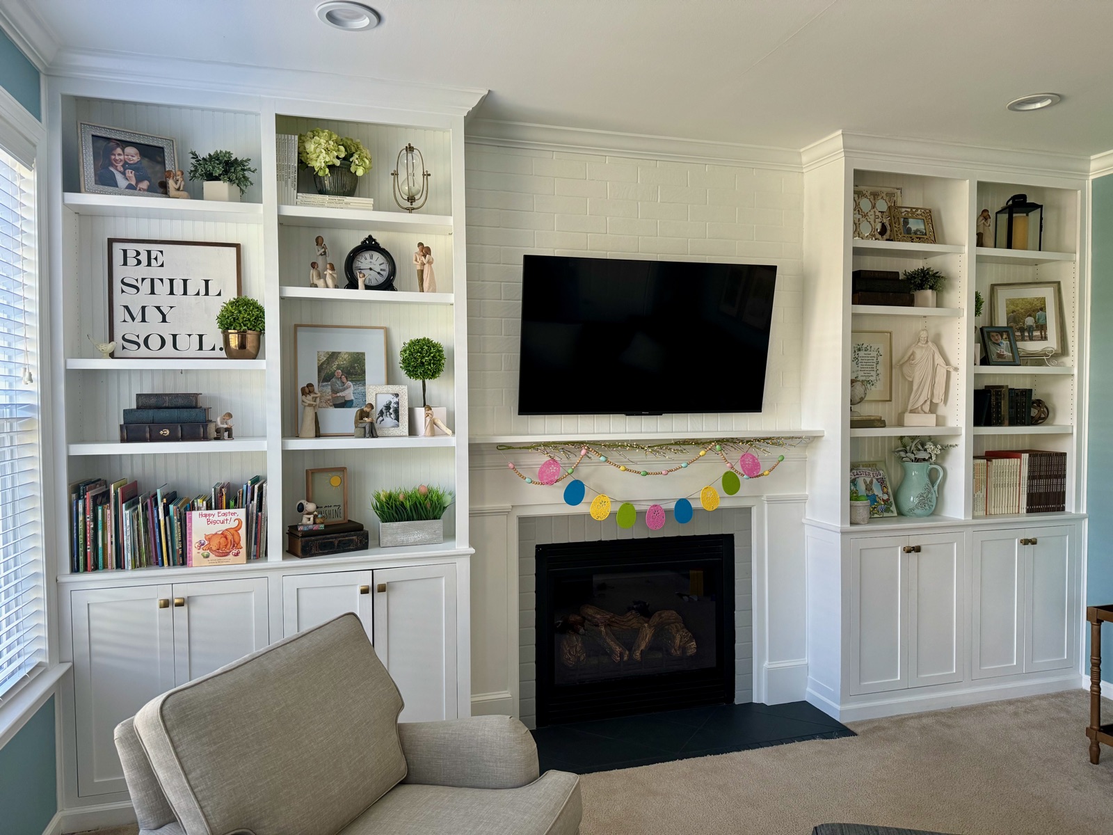 Custom entertainment wall with built-in cabinets and shelving