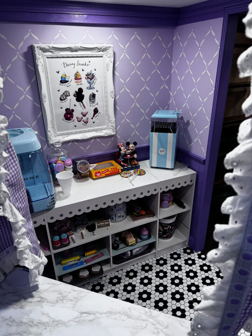 Inside the Sweet Shoppe — a built-in candy counter and shelves below a framed menu